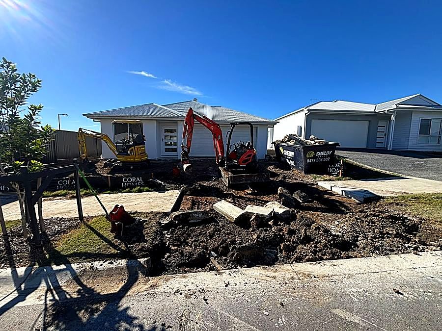 Driveway before: excavated crossover ready for concrete