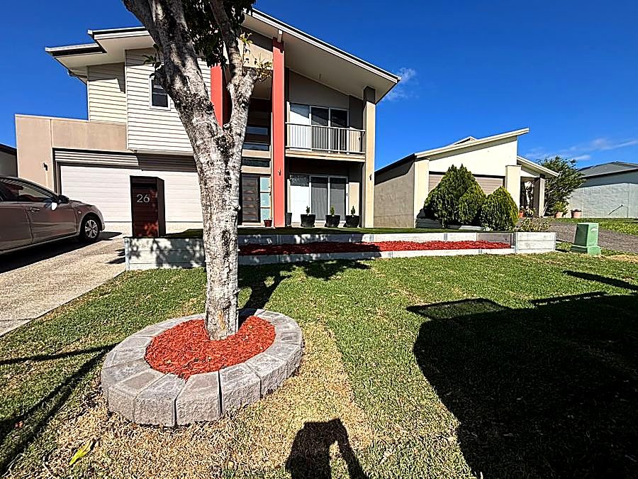 Front yard turf and mulched garden bed after landscaping